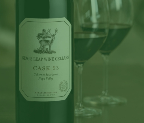 Stag's Leap Wine Cellars Cask 23 Napa Cabernet Sauvignon bottle beside two poured glasses of red wine